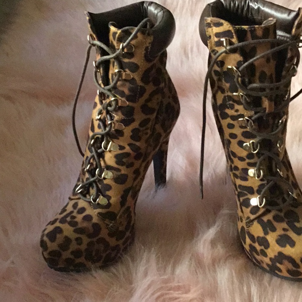 Leopard style print lace up boot heels.
